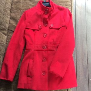 Red button-up coat.